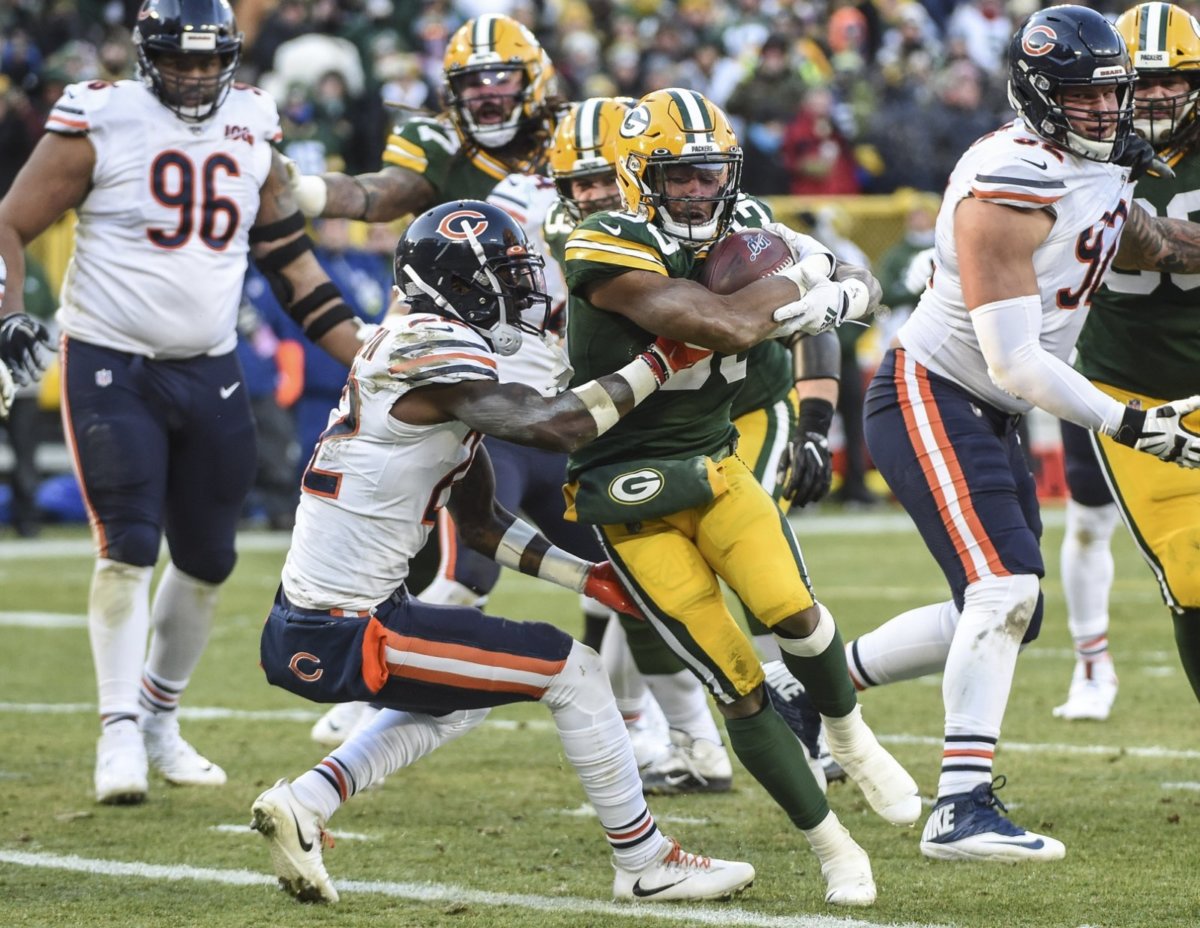 Once Again, Sunday’s Game Should NEVER Have Been So Close Packers RB Aaron Jones breaks tackle against the Bears