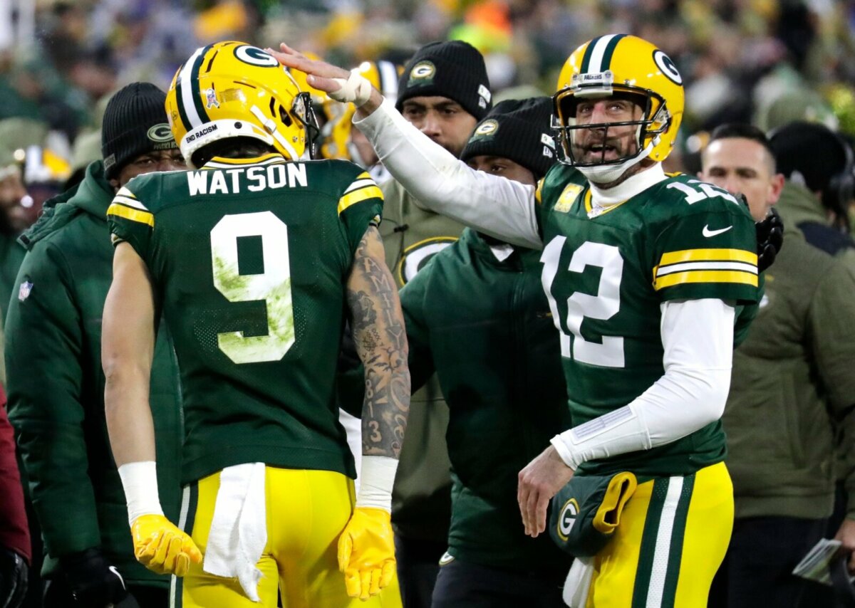 Green Bay Packers wide receiver Christian Watson (9) celebrates with Aaron Rodgers (12) after scoring a touchdown on a reception against the Dallas Cowboys during their football game Sunday, November 13, at Lambeau Field in Green Bay, Wis. Dan Powers/USA TODAY NETWORK-Wisconsin