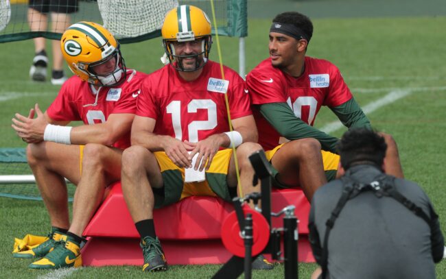 Green Bay Packers quarterback Aaron Rodgers (12) is shown with backup quarterbacks Tim Boyle (left) and Jordan Love at training camp.